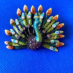 Peacock brooch.